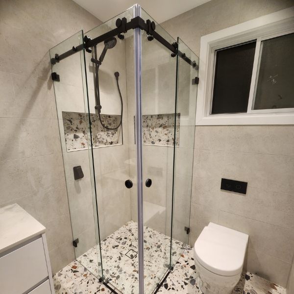 experience-the-unmatched-quality-of-showerland’s-frameless-sliding shower-screens